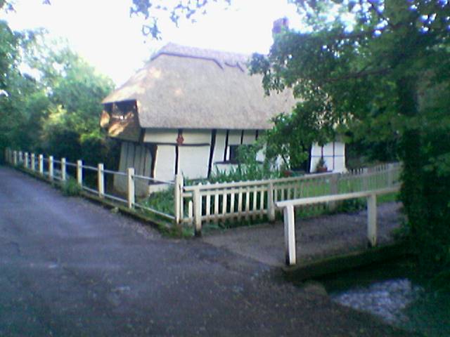 Picture of Old Kent Cottage from the northwest, showing the house overlooking Seabrook Stream.